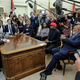 Rapper Kanye West, second right, flanked by NFL Hall of Famer Jim Brown, right, speaks during a meeting with President Donald Trump, left, in the Oval Office of the White House on October 11, 2018, in Washington, DC.
